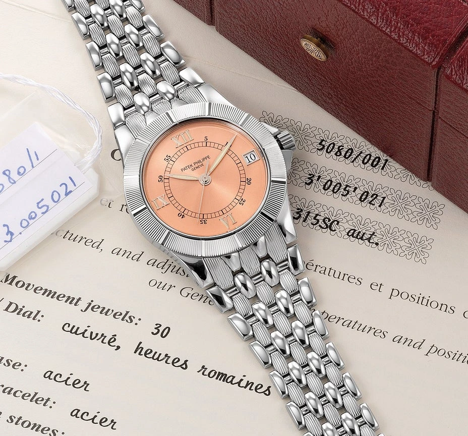 Patek Philippe Neptune 5080/001 in steel with copper dial and multi-link bracelet, photographed with its archive extract