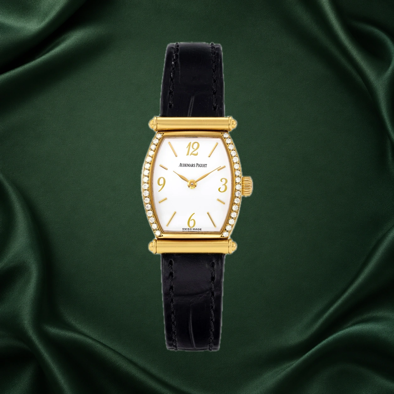 Audemars Piguet Carnegie 77153BA reference photograph, with a gold diamond-set case, white dial and black leather strap